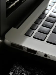 Free Detailed view of a silver laptop showing keyboard and multiple ports. Stock Photo